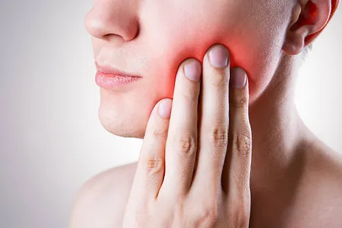 Patient with severe tooth pain seeking emergency dental relief in Hyderabad — Dr.Sri Sushma Dental Clinic Anandbagh